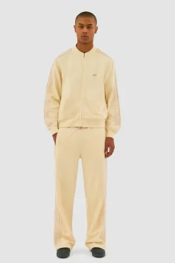 Arte Antwerp Pantalon à bandes fleuries - Crème Fashion