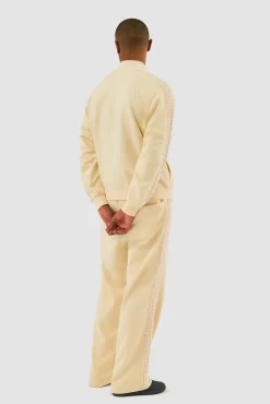 Arte Antwerp Pantalon à bandes fleuries - Crème Fashion